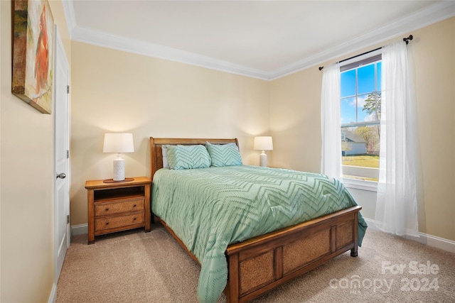 carpeted bedroom featuring ornamental molding