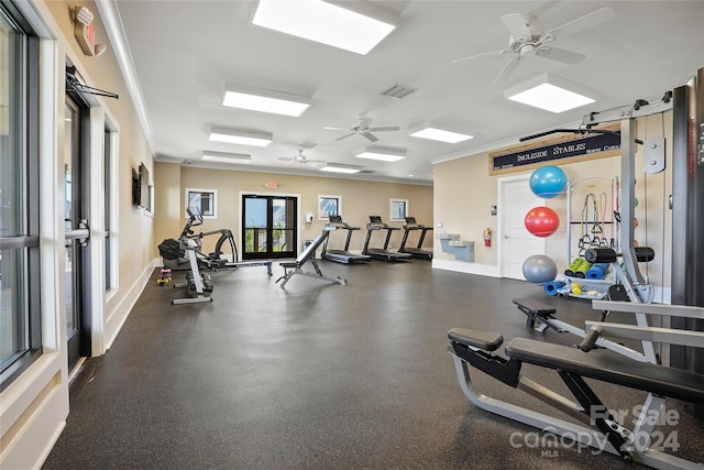 exercise room featuring ceiling fan and crown molding