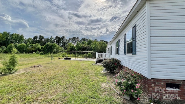 view of yard featuring a wooden deck