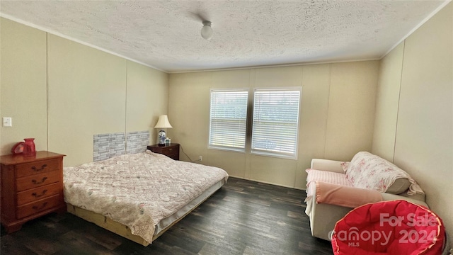1824 Germantown Pl, Dillon, SC 29536 - bedroom featuring a textured ceiling, dark wood finished floors, a decorative wall, and crown molding