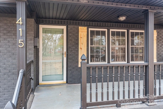 doorway to property featuring a porch