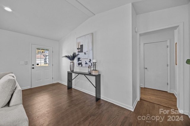 foyer featuring dark hardwood / wood-style flooring and lofted ceiling