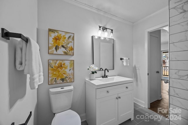 bathroom with crown molding, vanity, hardwood / wood-style flooring, and toilet