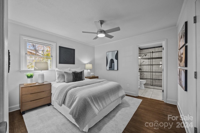 bedroom featuring crown molding, ceiling fan, hardwood / wood-style floors, and ensuite bathroom