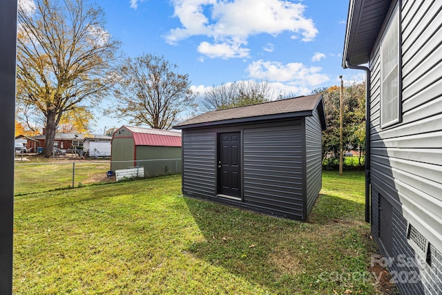 view of outbuilding featuring a lawn