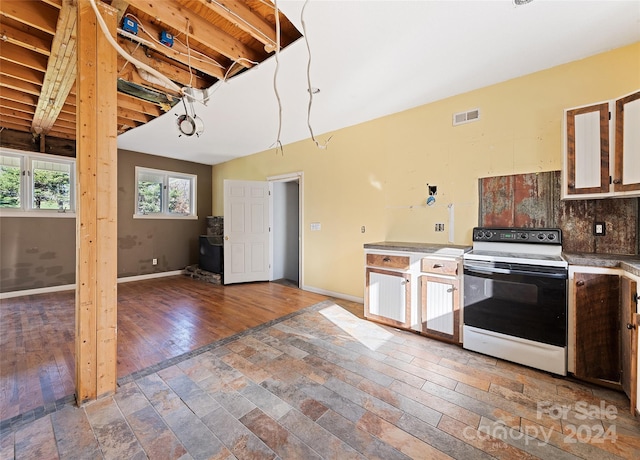 kitchen featuring backsplash, lofted ceiling with beams, white electric range oven, and hardwood / wood-style flooring