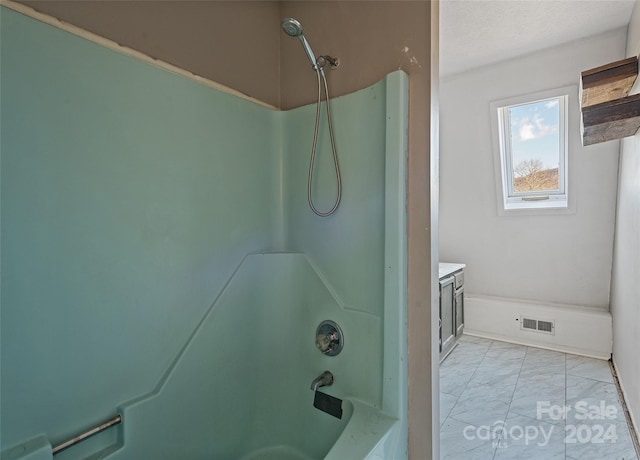 bathroom featuring vanity and shower / bathtub combination