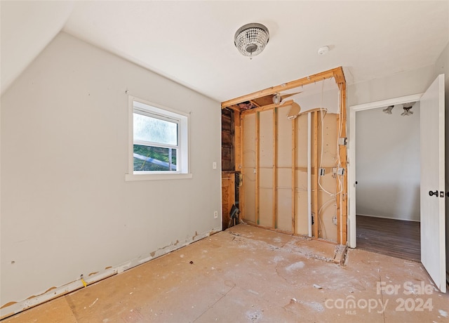 unfurnished bedroom with vaulted ceiling