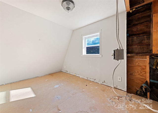 empty room with lofted ceiling