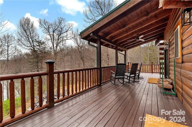 wooden deck featuring ceiling fan