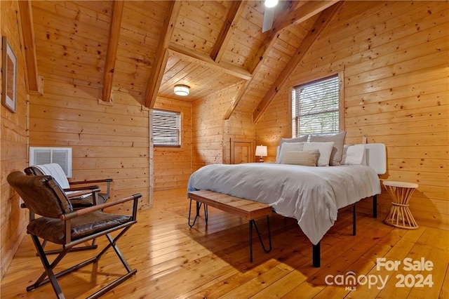 bedroom featuring vaulted ceiling with beams, light hardwood / wood-style flooring, wooden walls, and wood ceiling