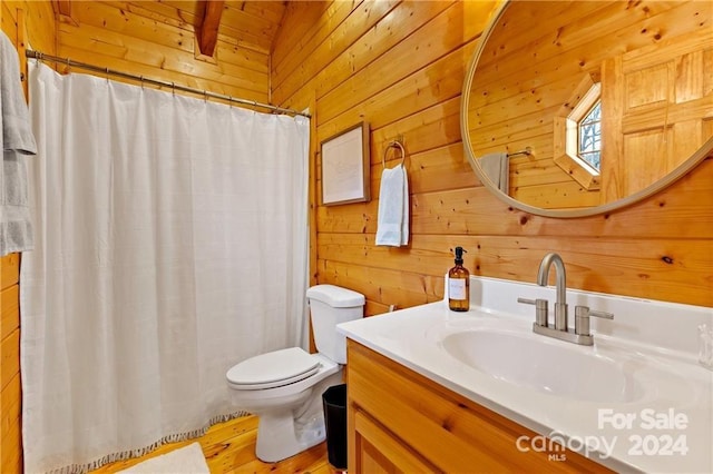 552 Lake Rd, Old Fort, NC 28762 - bathroom with wood walls, toilet, vanity, wood finished floors, and a shower with shower curtain