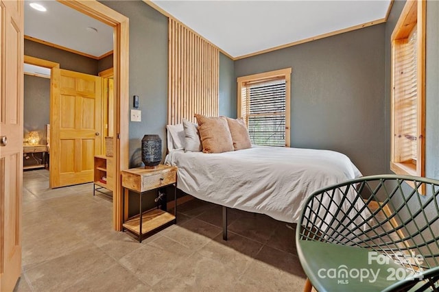 bedroom featuring crown molding