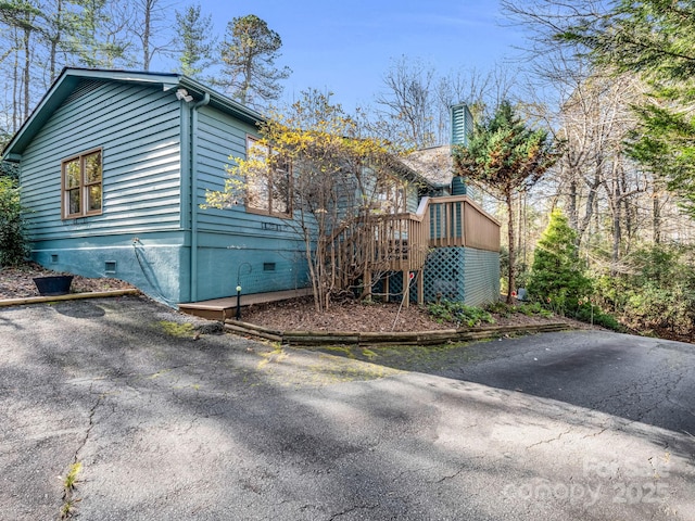 view of side of property with crawl space