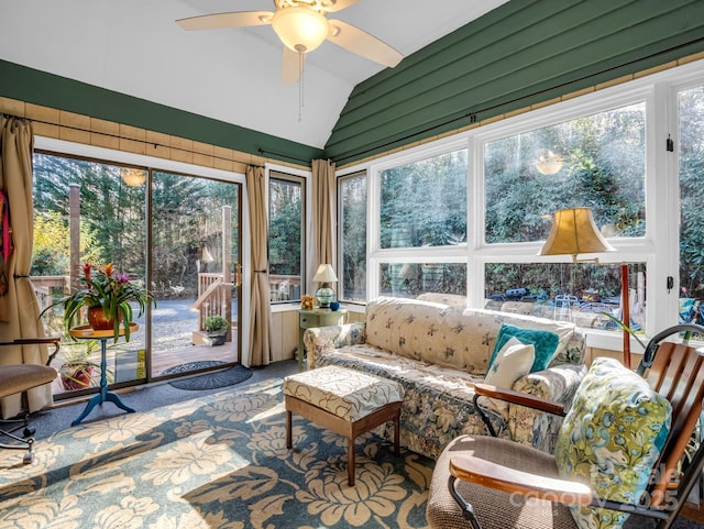 sunroom / solarium featuring lofted ceiling and a ceiling fan