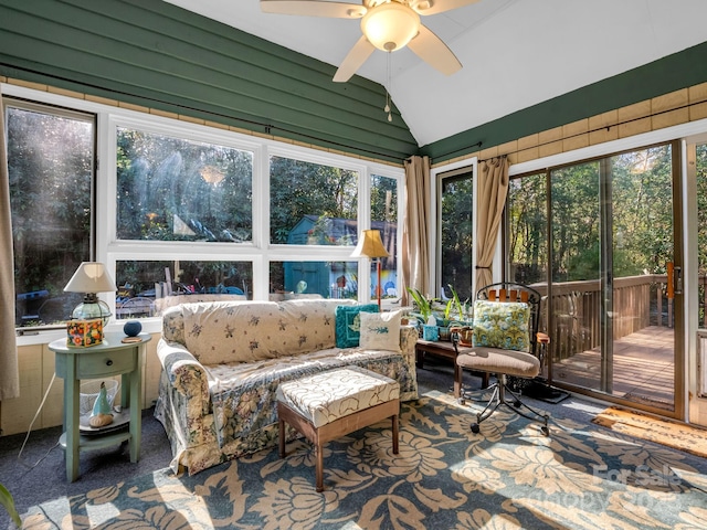 sunroom with vaulted ceiling and a ceiling fan