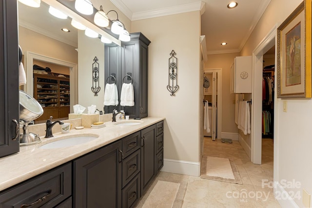 bathroom with tile patterned floors, vanity, and crown molding