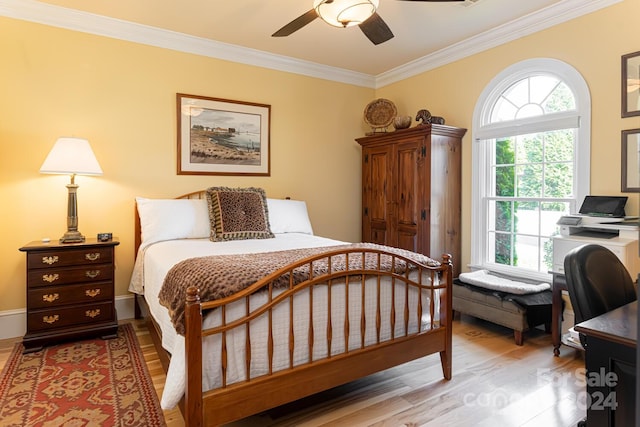 bedroom with ceiling fan, light wood-type flooring, and crown molding