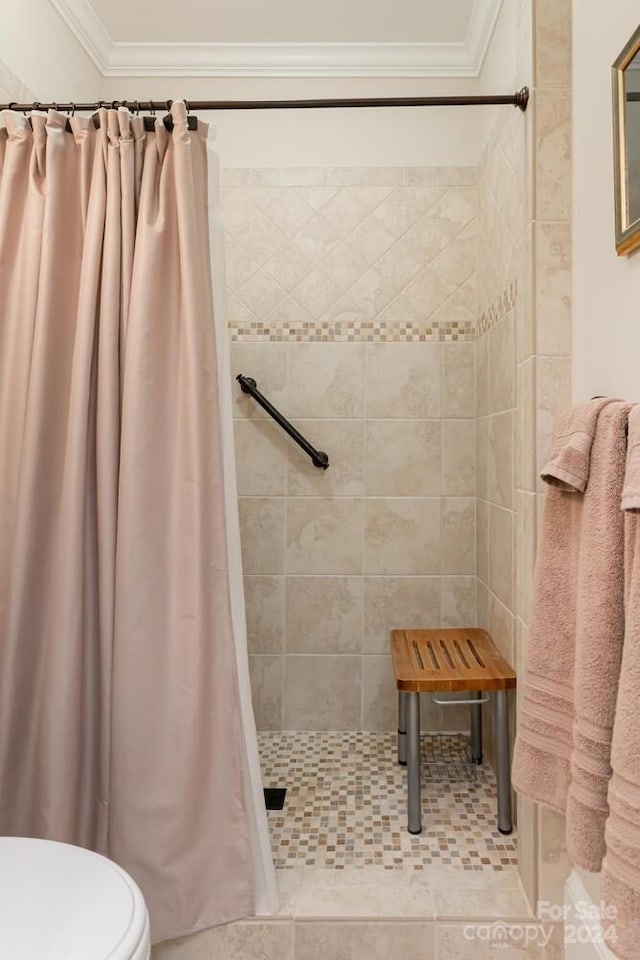 bathroom with a shower with shower curtain, tile patterned flooring, toilet, and ornamental molding