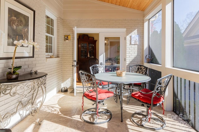 sunroom / solarium with lofted ceiling