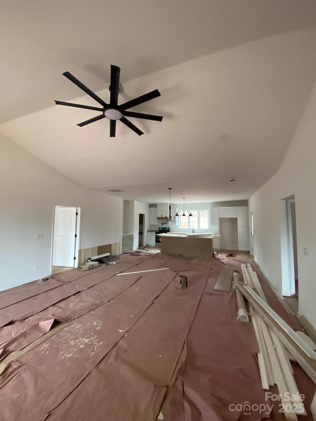 misc room with ceiling fan and lofted ceiling