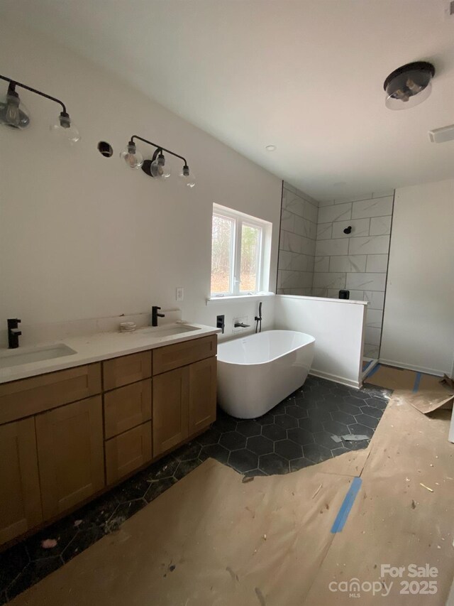 bathroom with vanity and separate shower and tub