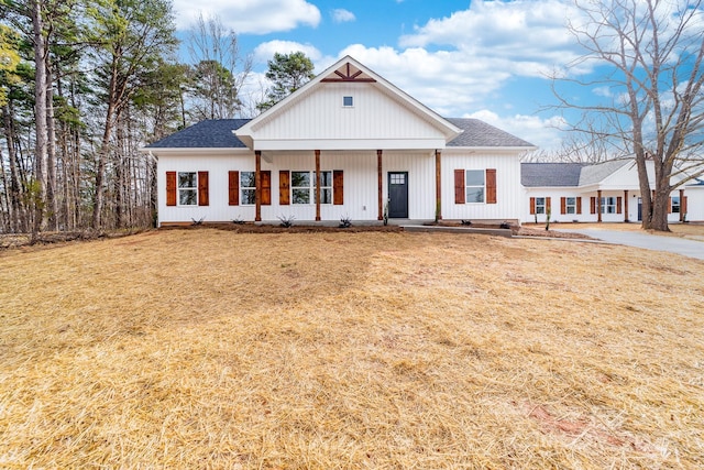 modern farmhouse with a front yard