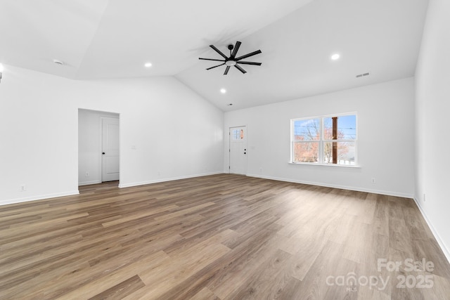 spare room with visible vents, baseboards, wood finished floors, and a ceiling fan