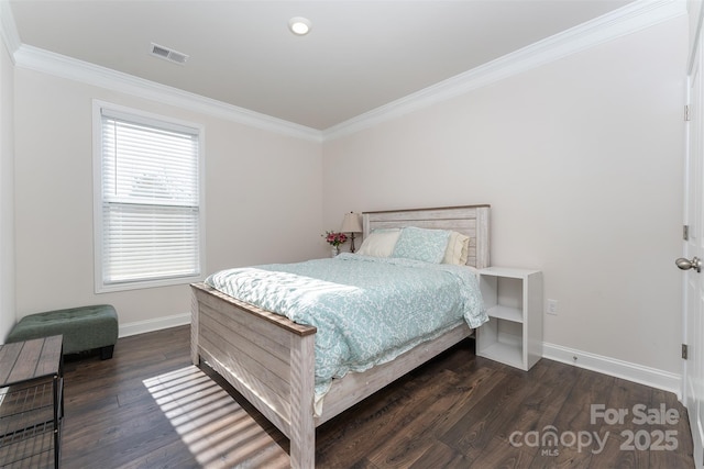 bedroom with dark hardwood / wood-style floors and ornamental molding