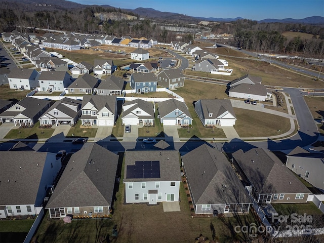 birds eye view of property with a mountain view