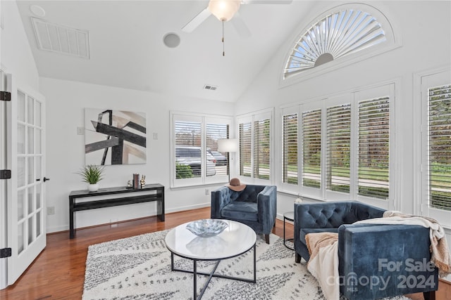 interior space featuring hardwood / wood-style floors, ceiling fan, and high vaulted ceiling