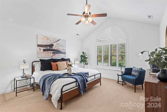 bedroom with light carpet, vaulted ceiling, and ceiling fan