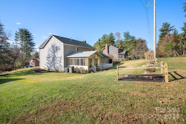 exterior space with central AC and a sunroom