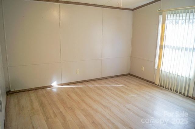 spare room with light wood-type flooring