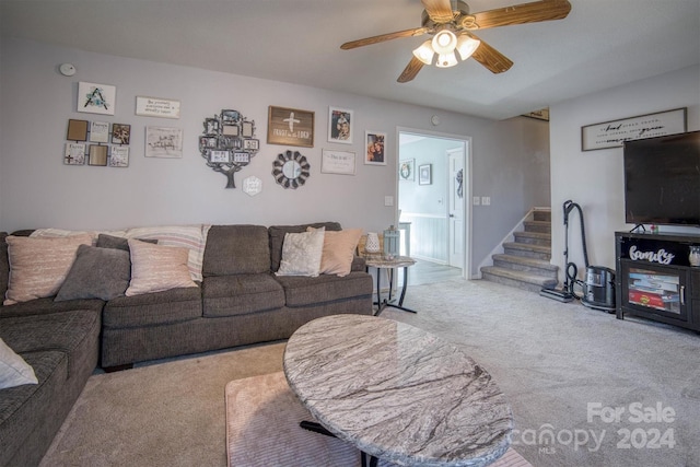 living room with ceiling fan and light carpet