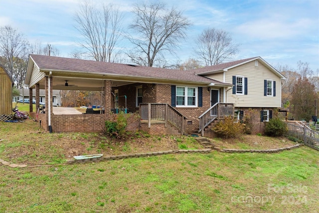 split level home with a front yard and ceiling fan