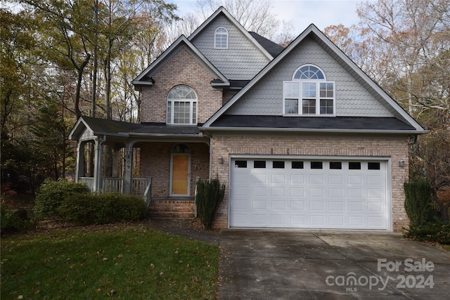 view of front of house with a porch and a garage