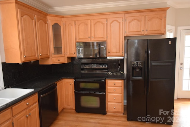 kitchen with backsplash, black appliances, sink, ornamental molding, and light hardwood / wood-style floors