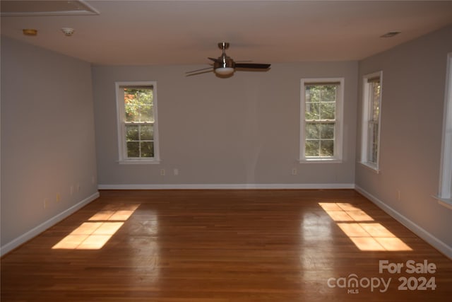 unfurnished room featuring ceiling fan and hardwood / wood-style floors