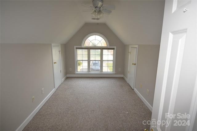 bonus room featuring light colored carpet, vaulted ceiling, and ceiling fan