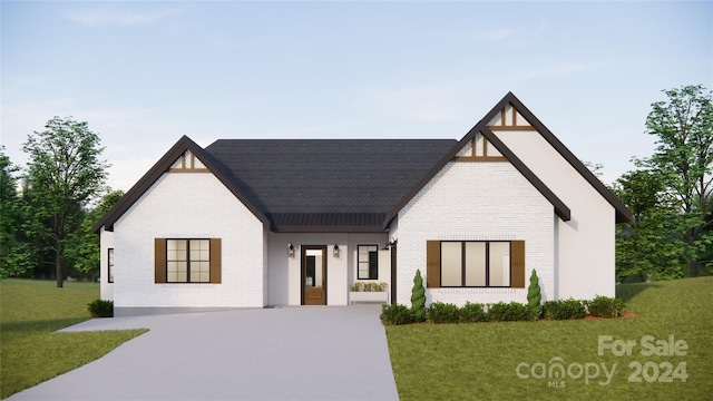 view of front of home featuring a front yard and covered porch