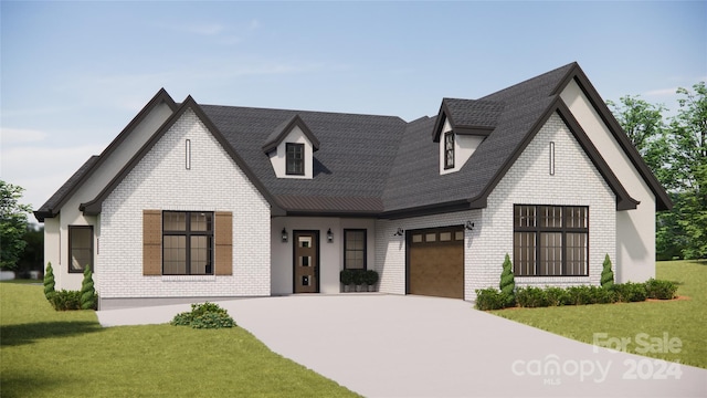 view of front of home featuring a garage and a front yard