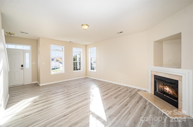 unfurnished living room with light hardwood / wood-style floors