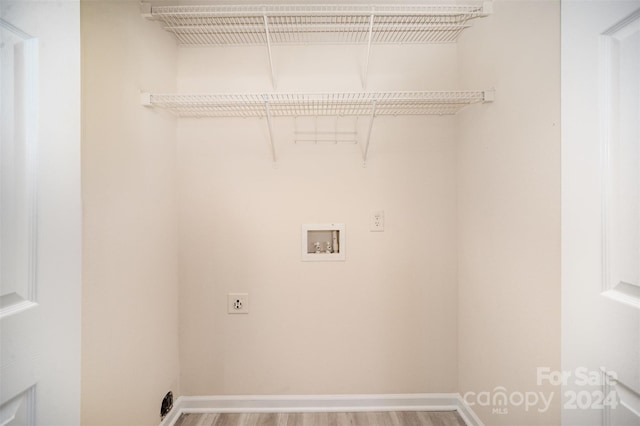 laundry room featuring hookup for an electric dryer, wood-type flooring, and hookup for a washing machine