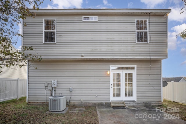 back of house featuring central AC unit