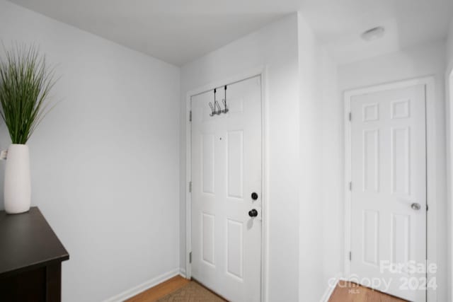 entryway with hardwood / wood-style flooring