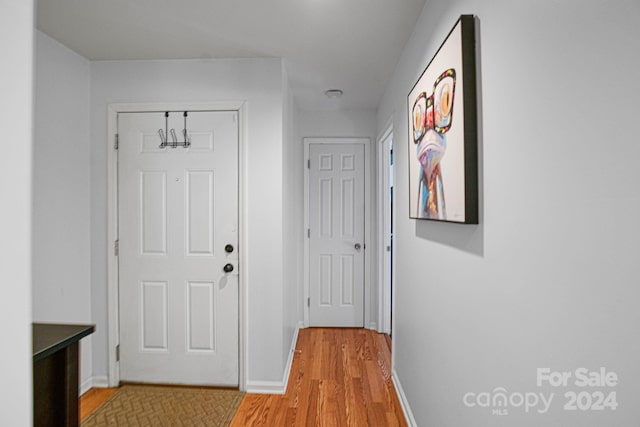 corridor featuring light hardwood / wood-style floors