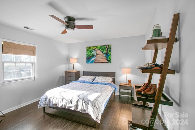 bedroom featuring ceiling fan and dark hardwood / wood-style flooring