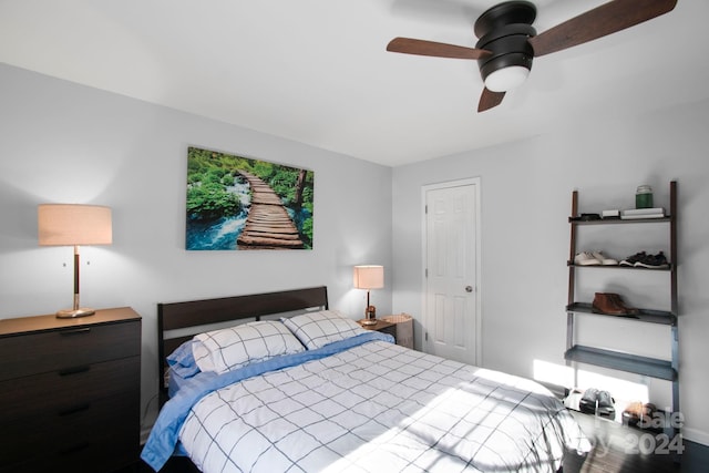 bedroom with hardwood / wood-style flooring and ceiling fan