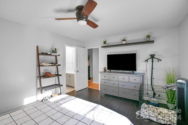 bedroom featuring ensuite bathroom, ceiling fan, and dark wood-type flooring